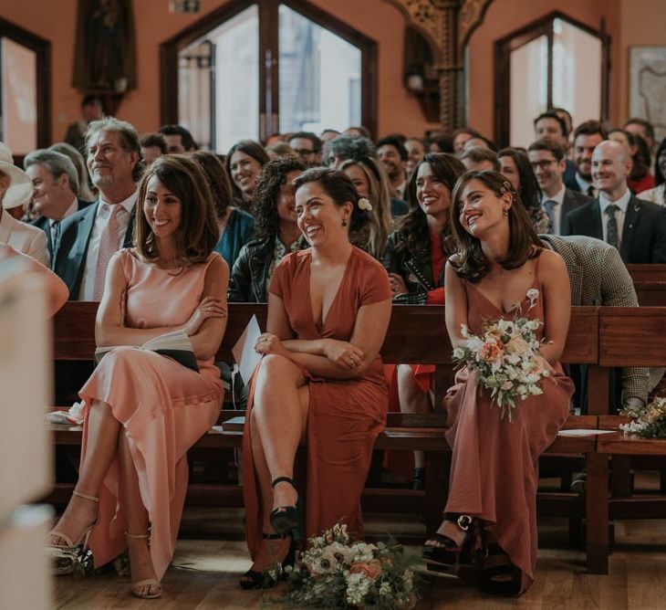 Bridesmaids In Mismatched Dresses During Ceremony