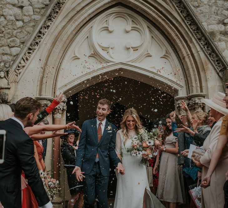 Bride In Wedding Cape and Groom Confetti Exit