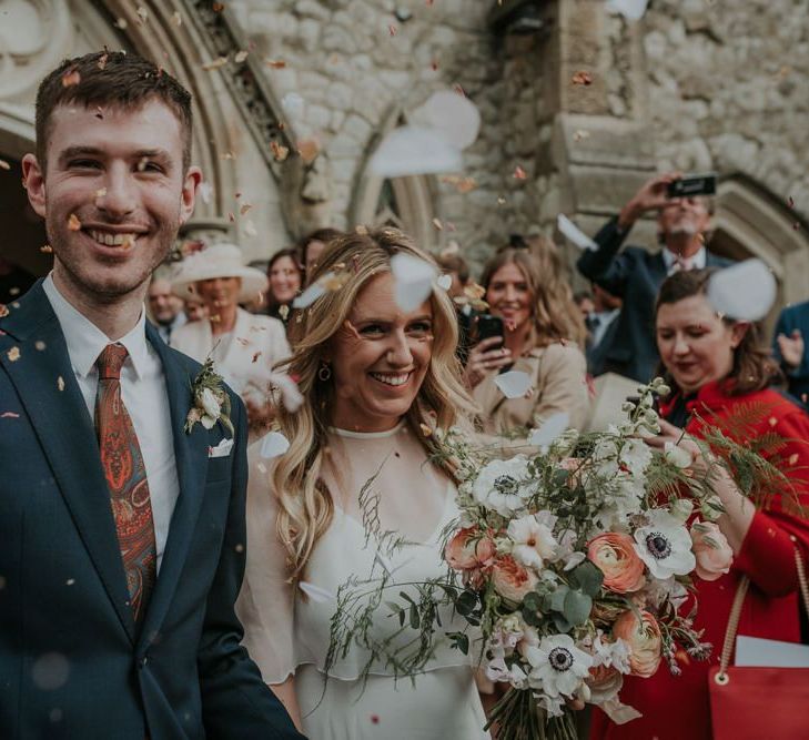 Bride In Wedding Cape and Groom Confetti Exit