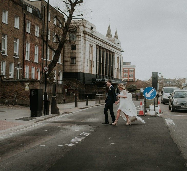 Bride and Groom Cross The Busy Roads For London Wedding