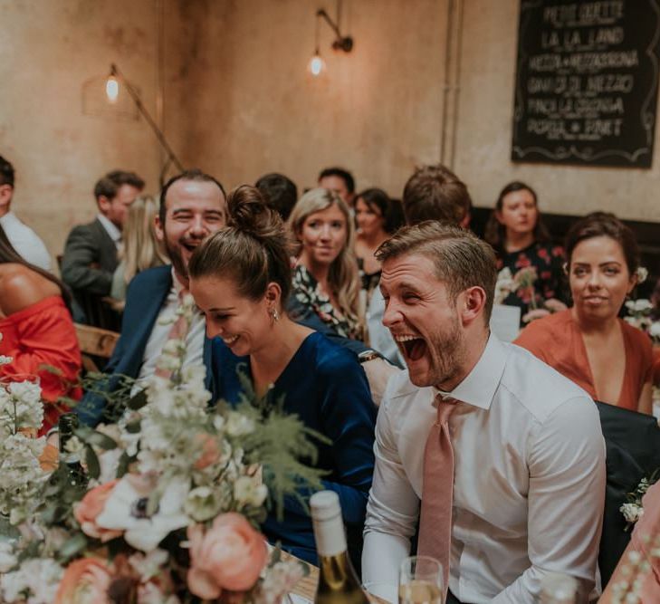 Guests Enjoy Speeches During Wedding Reception