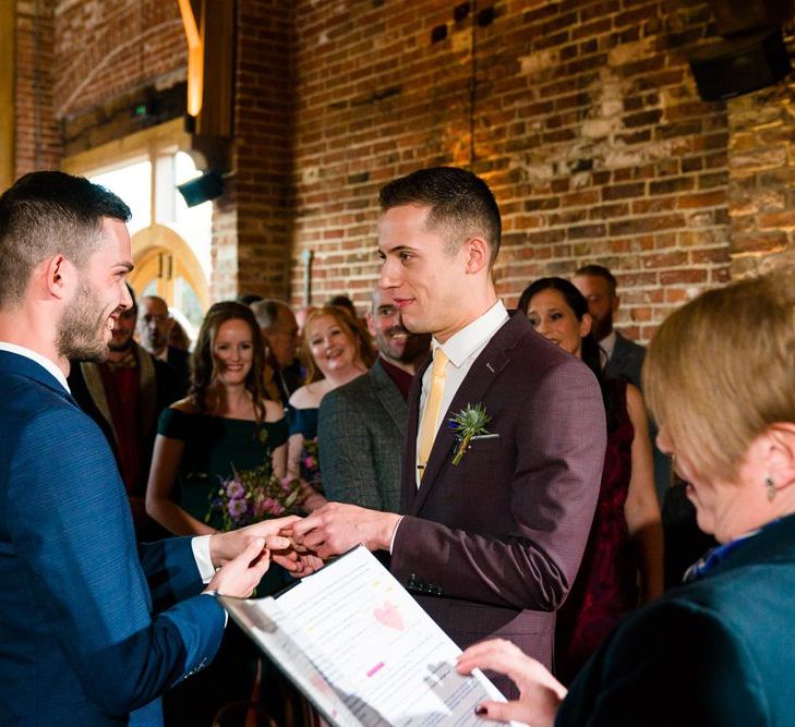 Two Grooms in Burgundy and Navy Remus Uomo Suits