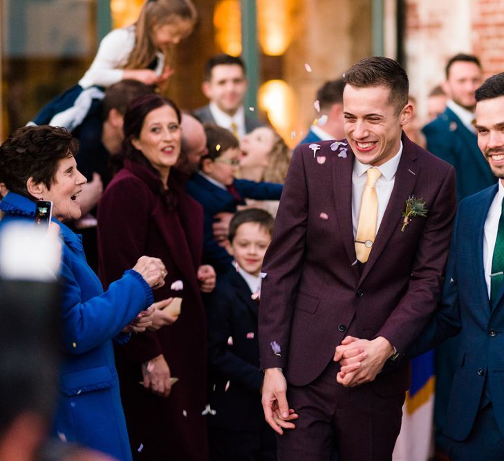 Confetti Moment with Grooms in Burgundy and Navy Remus Uomo Suits