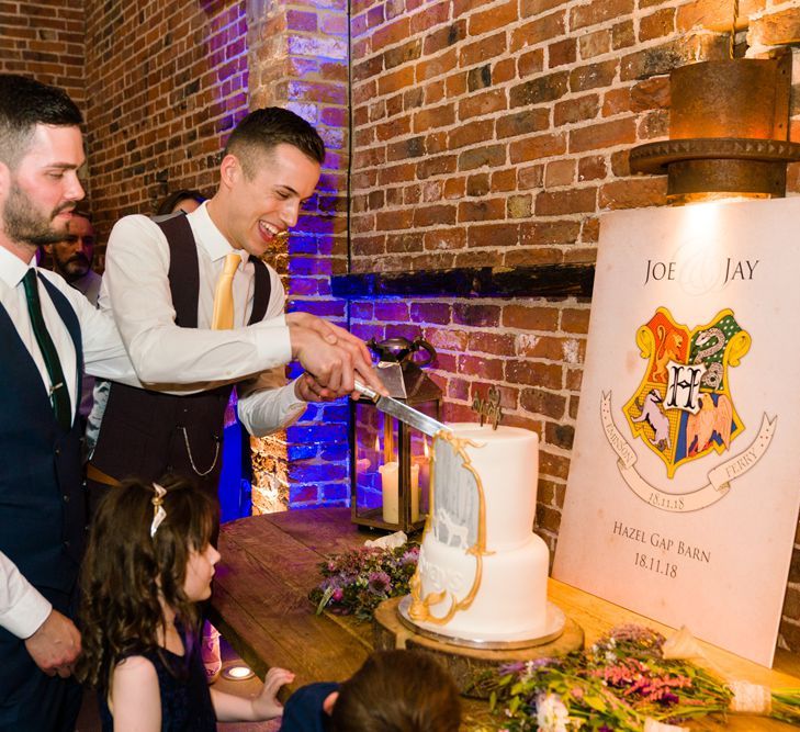 Two Grooms Cutting Harry Potter Wedding Cake