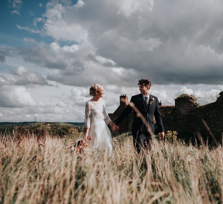 Bride in Beautiful Two Piece Gown and Groom in Three Piece Suit