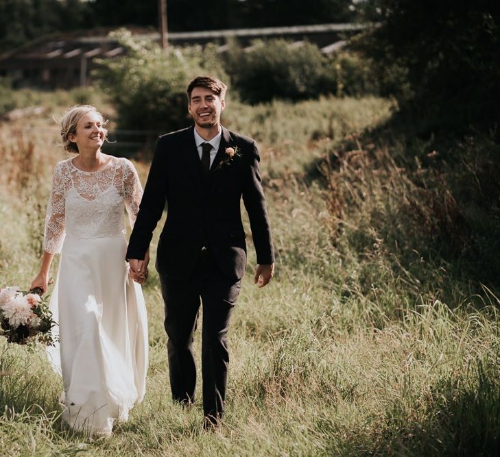 Bride in Handmade Two Piece Gown and Groom in Three Piece Suit