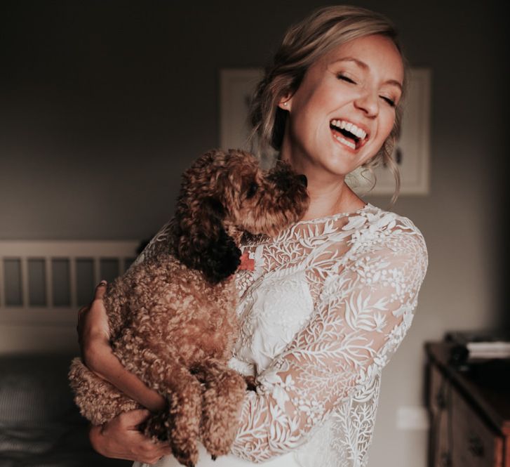 Bride in Two Piece Wedding Gown with Pet at Wedding