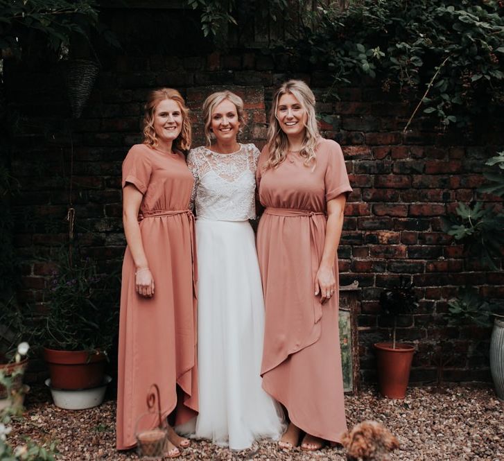 Bride in Two Piece Gown with Blush Bridesmaid Dresses