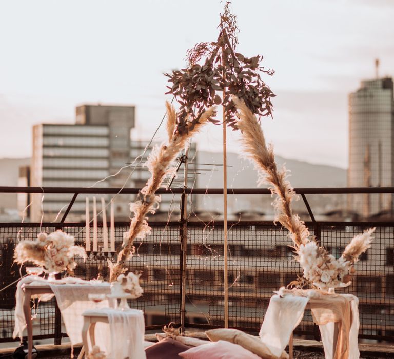 Boho rooftop wedding with naked tipi structure