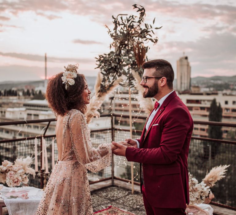 Bride and groom exchanging wedding rings