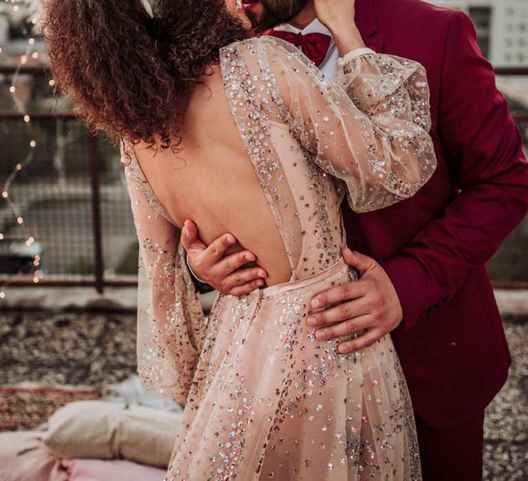 Bride in colourful sparkle wedding dress with backless detail