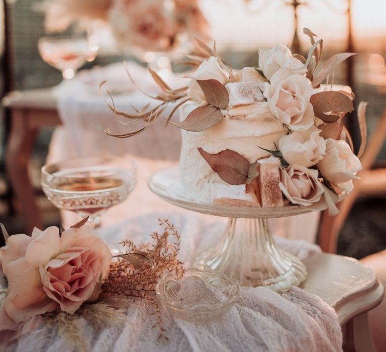 single tier wedding cake with blush roses