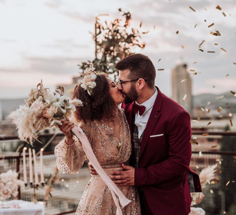 Confetti moment at intimate rooftop wedding