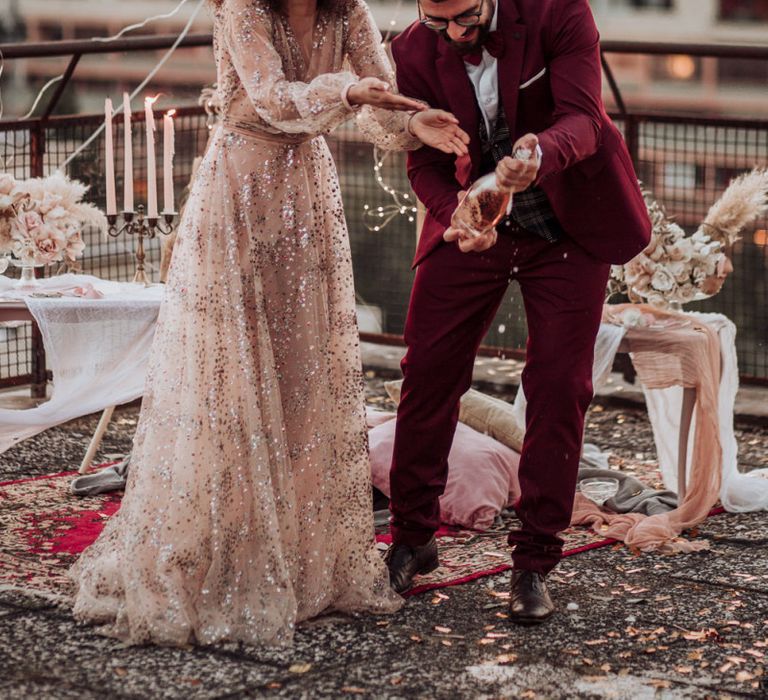 Bride in tulle sparkle wedding dress with curly hair at rooftop wedding