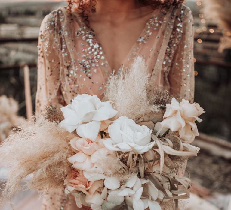 Neutral wedding bouquet with roses, orchids and pampas grass