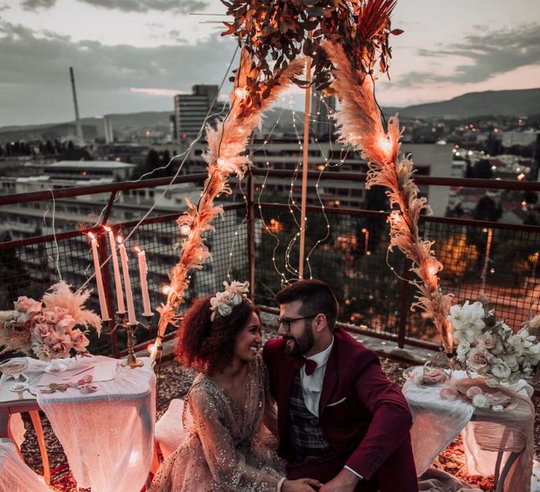 Intimate rooftop picnic with boho wedding styling