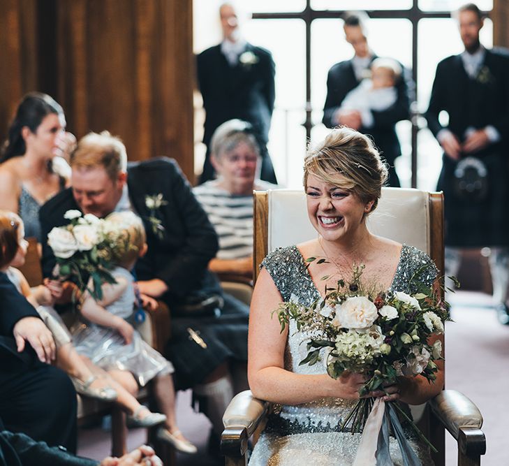 Bride in Embellished Shoulder Sequin Dress with Drop Waist by Eliza Jane Howell | 1920s Style Pearl Draping Headpiece | Bridal Bouquet with White Flowers, Foliage and Grey and Pink Trailing Ribbons | Wedding Ceremony at Stoke Newington Town Hall | Metallic Confetti Cannons and Paper Lanterns with Bride in Beaded Shoulder Eliza Jane Howell Dress | Miss Gen Photography