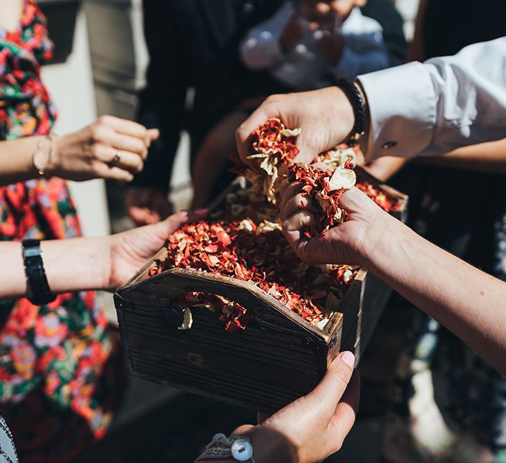 Red and White Biodegradable Confetti | Wedding Ceremony at Stoke Newington Town Hall | Metallic Confetti Cannons and Paper Lanterns with Bride in Beaded Shoulder Eliza Jane Howell Dress | Miss Gen Photography