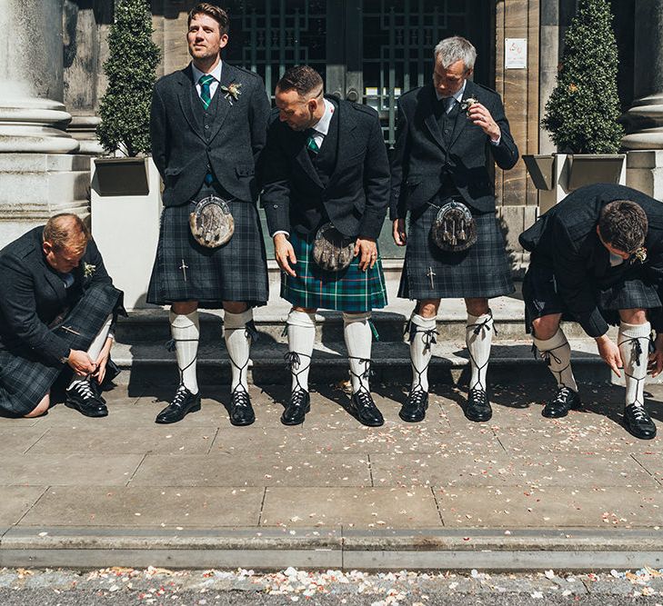 Groom in Green and Blue Tartan Kilt | Groomsmen in Grey Tartan Kilts | Metallic Confetti Cannons and Paper Lanterns with Bride in Beaded Shoulder Eliza Jane Howell Dress | Miss Gen Photography