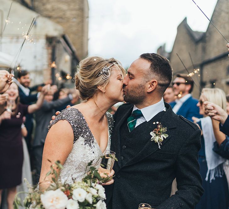 Confetti Cannon | Sparklers | Bride in Embellished Shoulder Sequin Dress with Drop Waist by Eliza Jane Howell | 1920s Style Pearl Draping Headpiece | Bridal Bouquet with White Flowers, Foliage and Grey and Pink Trailing Ribbons | Groom in Green and Blue Tartan Kilt | Clapton Country Club Wedding Reception | Metallic Confetti Cannons and Paper Lanterns with Bride in Beaded Shoulder Eliza Jane Howell Dress | Miss Gen Photography