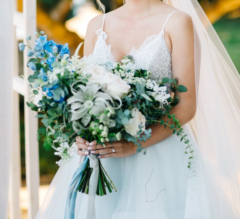 Outdoor Wedding Ceremony | Bride in Coloured Hayley Paige Wedding Dress | Oversized Bouquet | Pastel Blue &amp; Green, Romantic, Destination Wedding at Corfu Luxury Villas, Planned by Rosmarin Weddings &amp; Events | Mikhail Balygin Fine Art Wedding Photographer