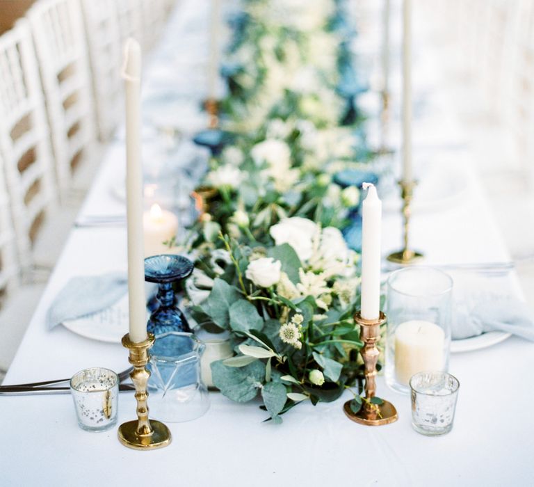 Elegant Tablescape with Coloured Goblets, Floral Table Runner, Taper Candles &amp; Geode Name Place | Pastel Blue &amp; Green, Romantic, Destination Wedding at Corfu Luxury Villas, Planned by Rosmarin Weddings &amp; Events | Mikhail Balygin Fine Art Wedding Photographer