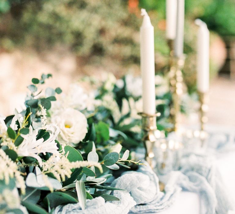 Elegant Tablescape with Coloured Goblets, Floral Table Runner, Taper Candles &amp; Geode Name Place | Pastel Blue &amp; Green, Romantic, Destination Wedding at Corfu Luxury Villas, Planned by Rosmarin Weddings &amp; Events | Mikhail Balygin Fine Art Wedding Photographer