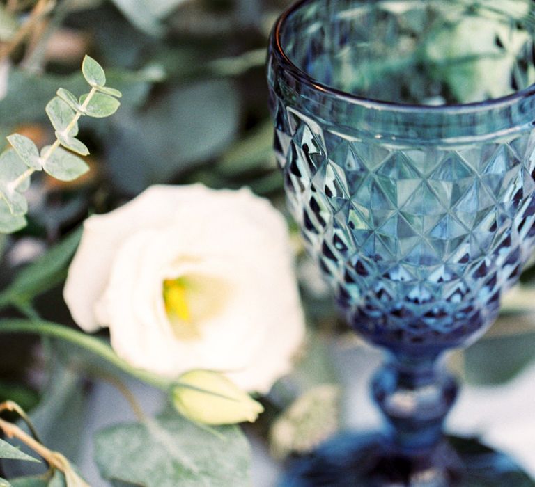 Elegant Tablescape with Coloured Goblets, Floral Table Runner, Taper Candles &amp; Geode Name Place | Pastel Blue &amp; Green, Romantic, Destination Wedding at Corfu Luxury Villas, Planned by Rosmarin Weddings &amp; Events | Mikhail Balygin Fine Art Wedding Photographer