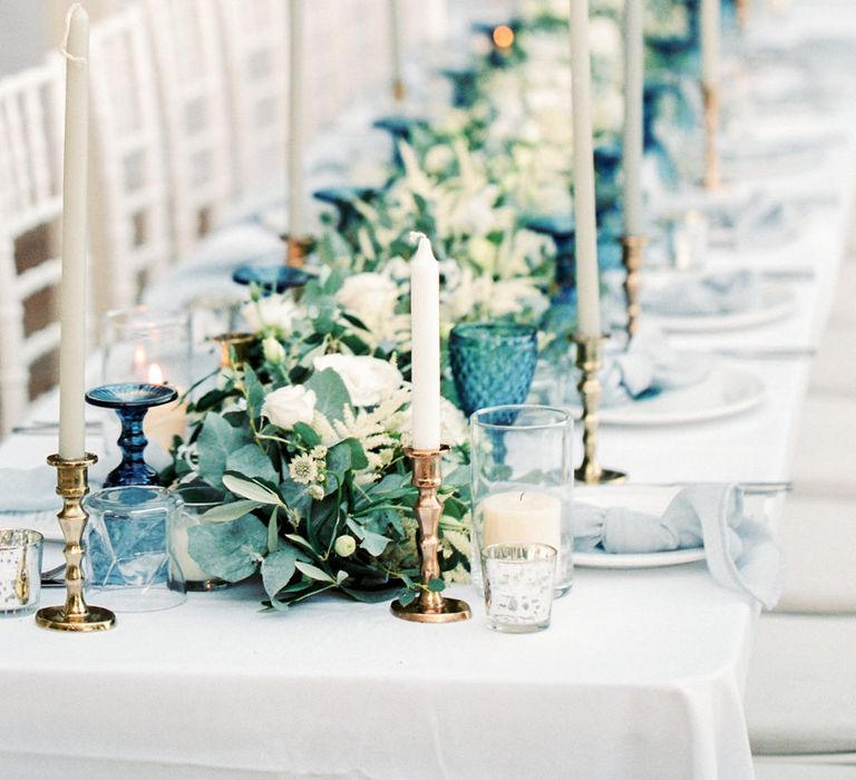 Elegant Tablescape with Coloured Goblets, Floral Table Runner, Taper Candles &amp; Geode Name Place | Pastel Blue &amp; Green, Romantic, Destination Wedding at Corfu Luxury Villas, Planned by Rosmarin Weddings &amp; Events | Mikhail Balygin Fine Art Wedding Photographer