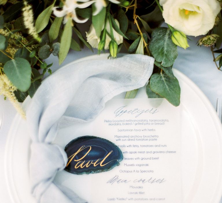 Elegant Place Setting with Coloured Goblet, Floral Table Runner, Taper Candles &amp; Geode Name Place | Pastel Blue &amp; Green, Romantic, Destination Wedding at Corfu Luxury Villas, Planned by Rosmarin Weddings &amp; Events | Mikhail Balygin Fine Art Wedding Photographer