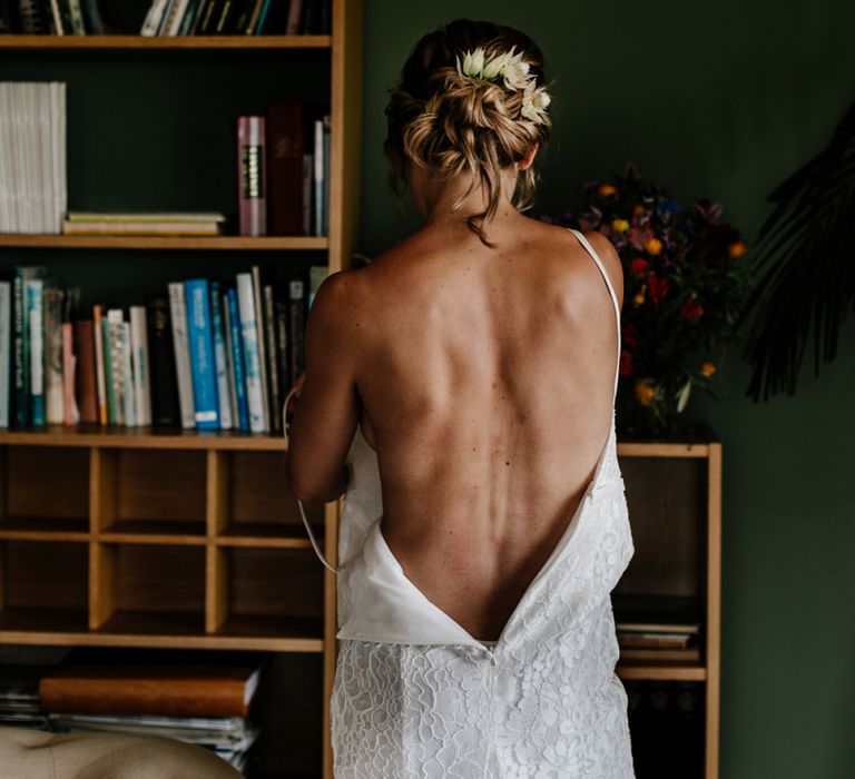 Bride Getting Ready in Made with Love Lace Wedding Dress