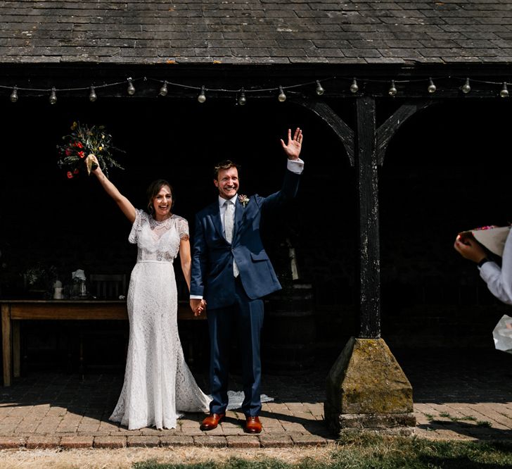 Elmley Nature Reserve Wedding Bride in Lace Made with Love Wedding Dress and Groom in Navy Suit Just Married