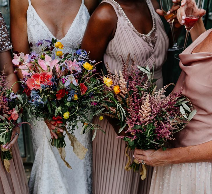 Bridesmaids in Dusky Pink Dresses Holding Pink Posies