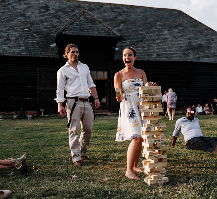 Wedding Guests Playing Giant Jenga Garden Games Elmley Nature Reserve Wedding