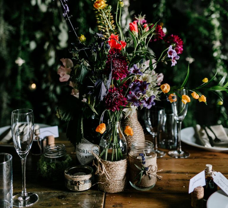 Colourful Wild Flowers in Bottles Wrapped in Twine