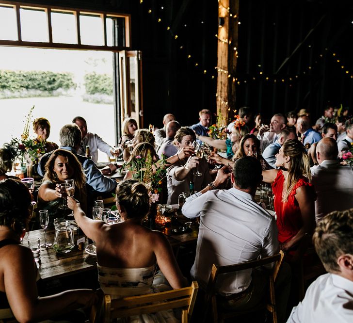 Wedding Guests Enjoying the Barn Wedding Reception at Elmley Nature Reserve