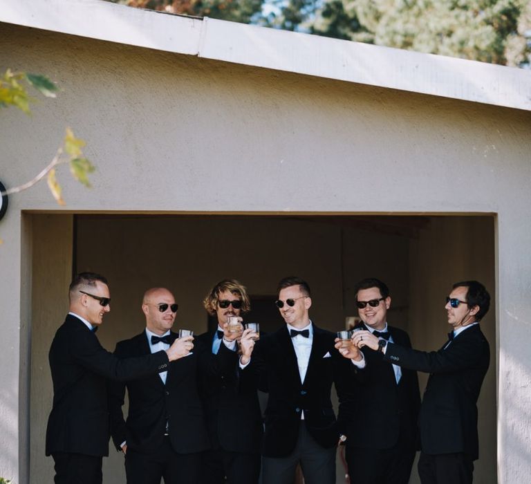 Groomsmen Wear Tuxedos For Black Tie Wedding