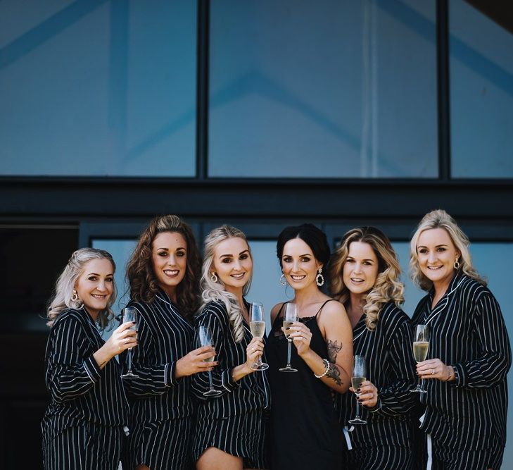 Bridal Party During Wedding Preparations In Matching Pyjamas