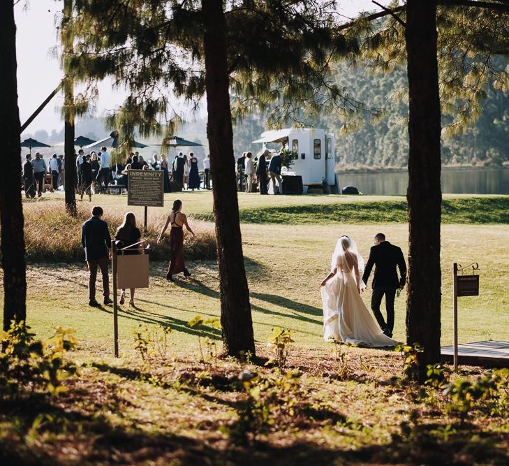 Bride And Groom Walk Up To Haycroft Farm Wedding Venue