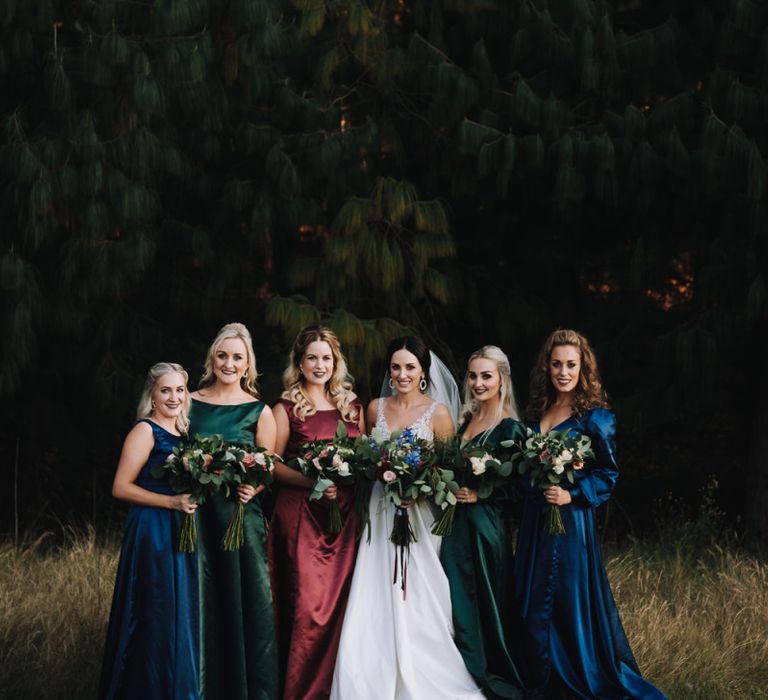 Bridal Party In Different Coloured Bridesmaid Dresses