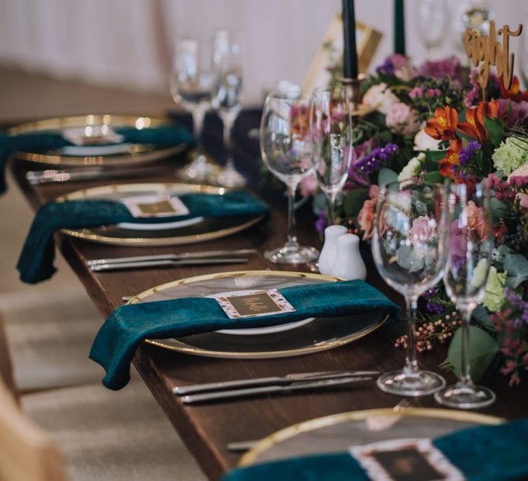 Wedding Table Place Settings With Velvet Napkins And Bright Flowers