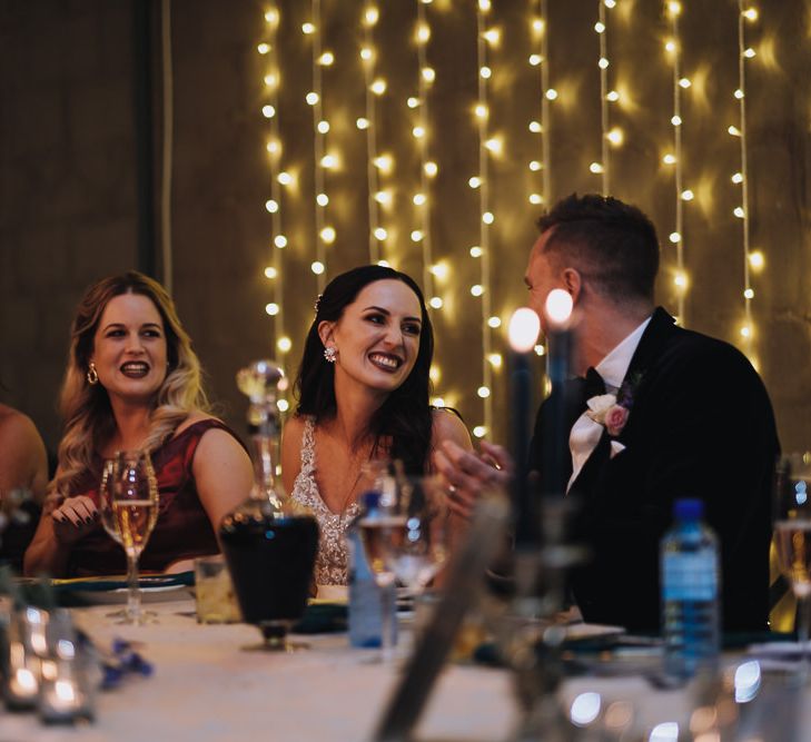 Bride and Groom Enjoy Wedding Speeches Alongside Polaroid Guest Book