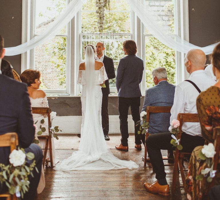 Intimate Wedding Ceremony with Bride and Groom at the Altar