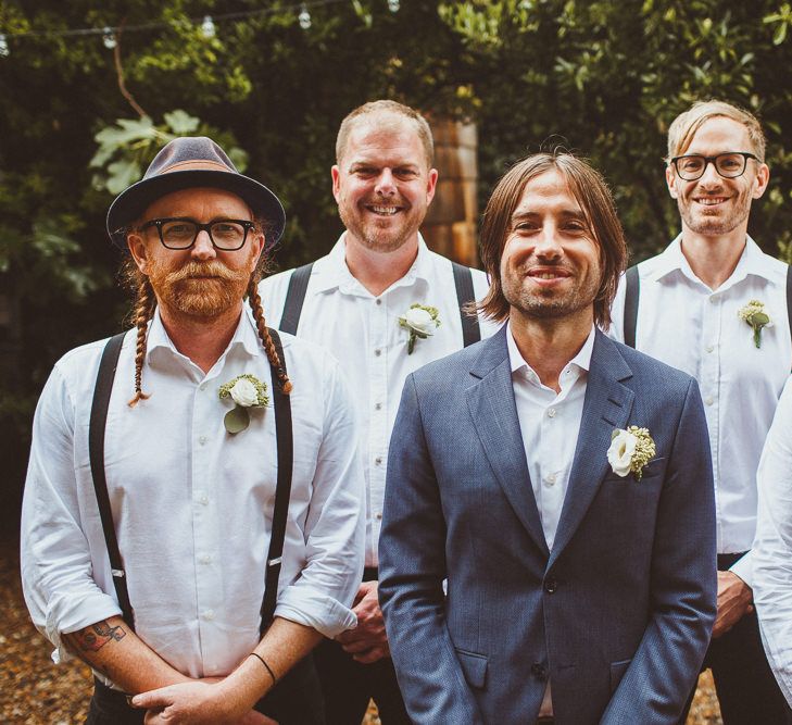 Groom in White Shirt and Blue Blazer and Groomsmen in White Shirt and Braces