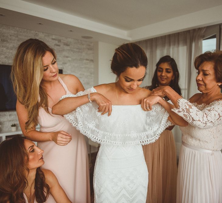 Bride Getting Ready into a Grace Loves Lace Dress on Morning