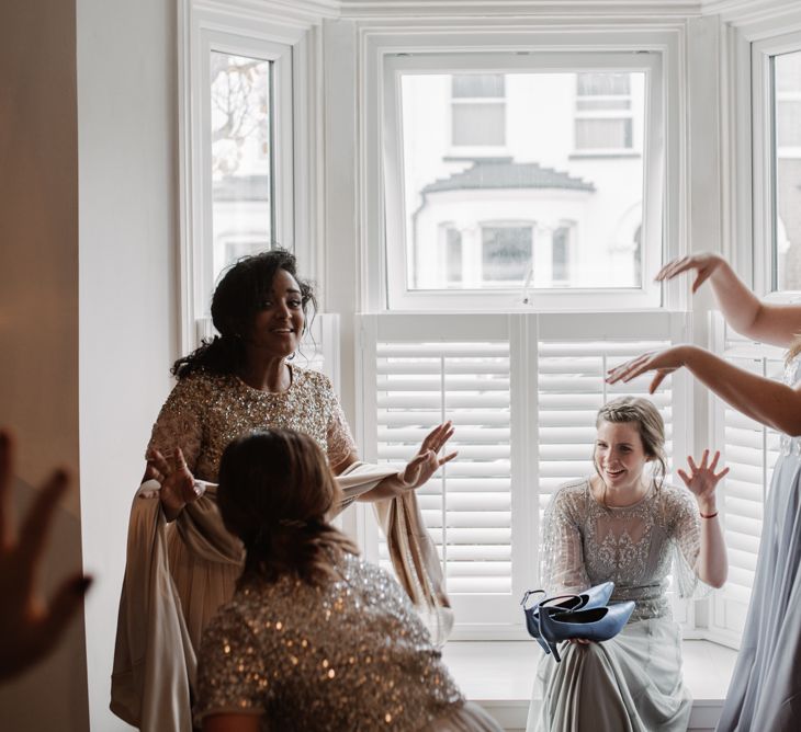 Bridesmaids In Sequinned Dresses // Christmas London Fields Brewery Wedding With Bride In Bespoke Dress By Katrine Mikklesen And Images From Taylor Hughes Photography