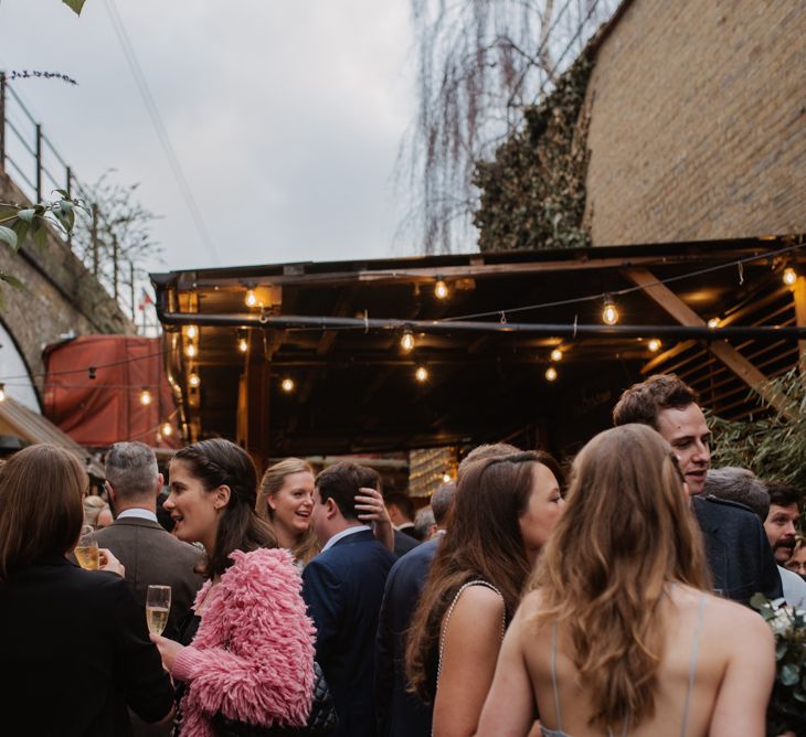 Christmas London Fields Brewery Wedding With Bride In Bespoke Dress By Katrine Mikklesen And Images From Taylor Hughes Photography