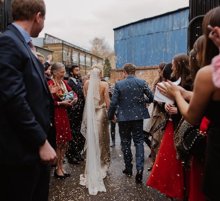 Confetti Moment // Christmas London Fields Brewery Wedding With Bride In Bespoke Dress By Katrine Mikklesen And Images From Taylor Hughes Photography