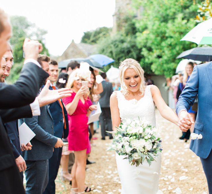 Confetti Moment  with Bride in Lace St Patrick Wedding Dress and Groom in Blue Reiss Suit