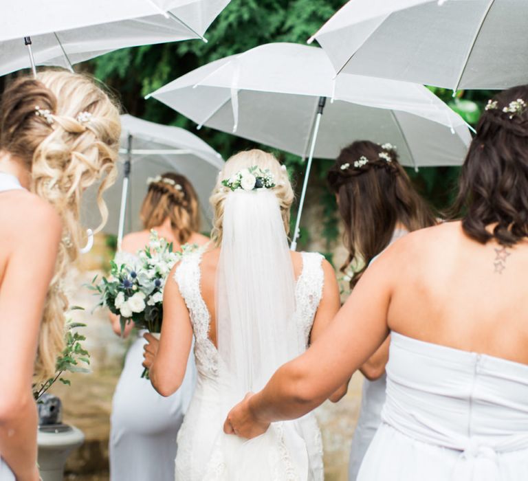 Bridal Party Helping The Bride with her Train